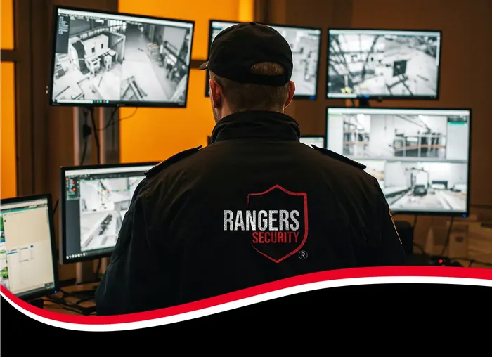 Security Professional operator watching live camera feeds, highlighting smart monitoring solutions for property safety.