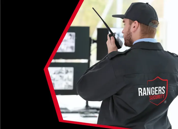 Security operator watching live camera feeds for Nunavut property protection